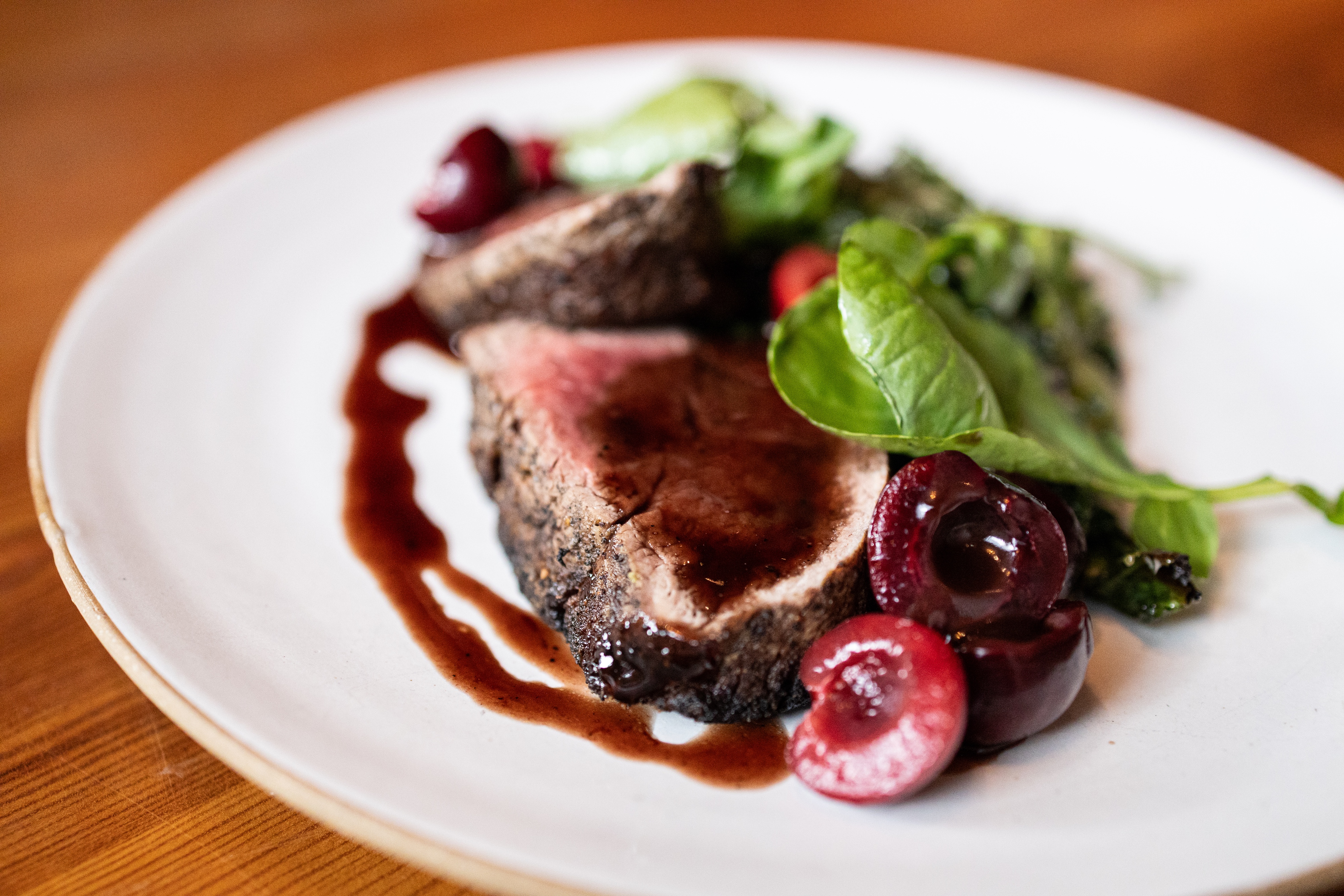a plate of food on a wood table