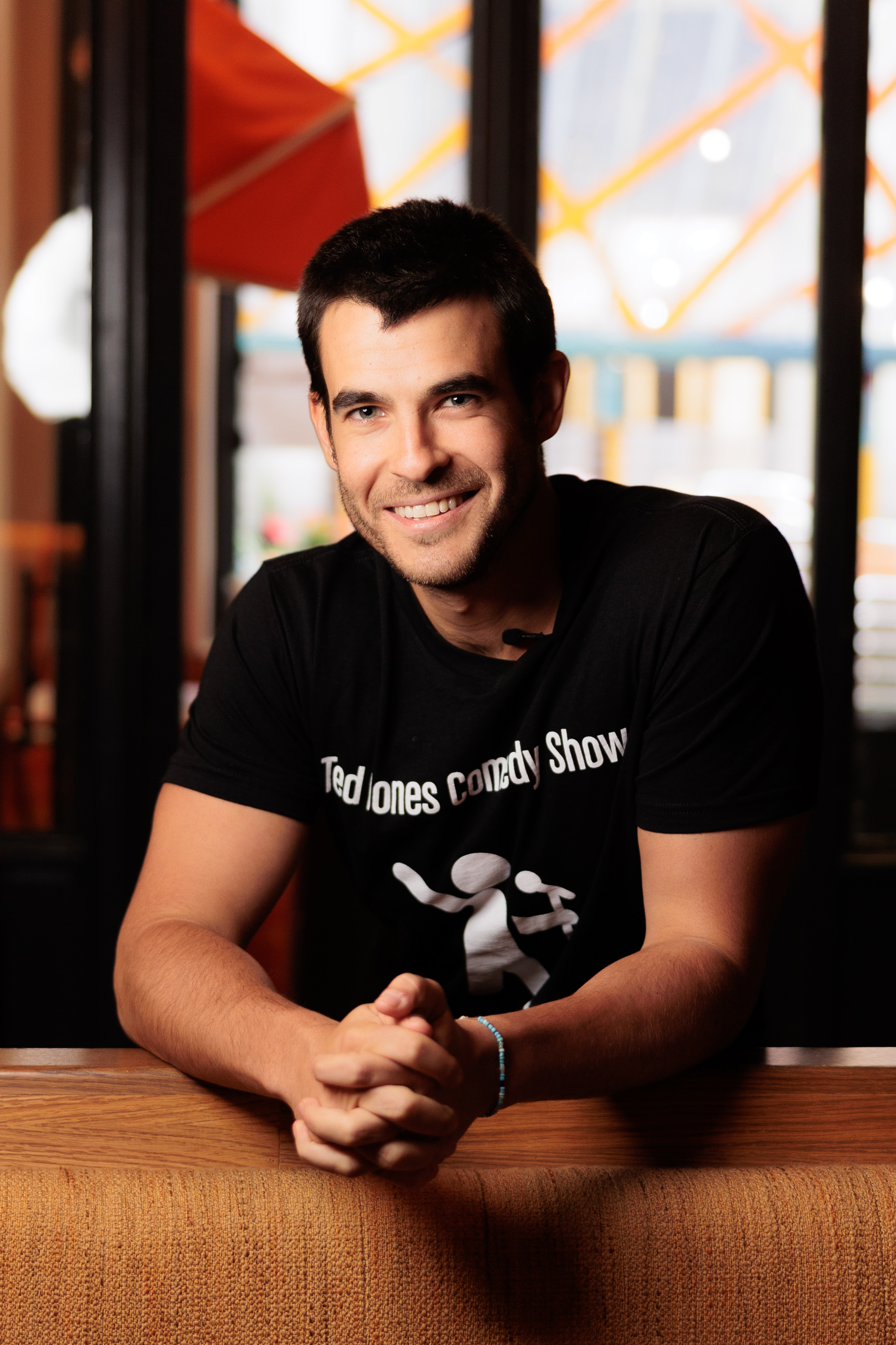 a man sitting in front of a window