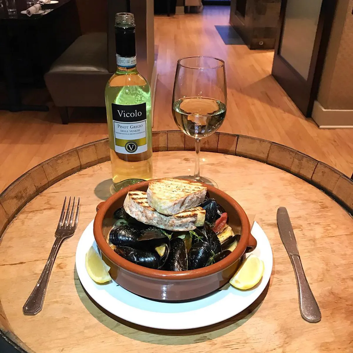 a plate of food with a glass of beer on a table