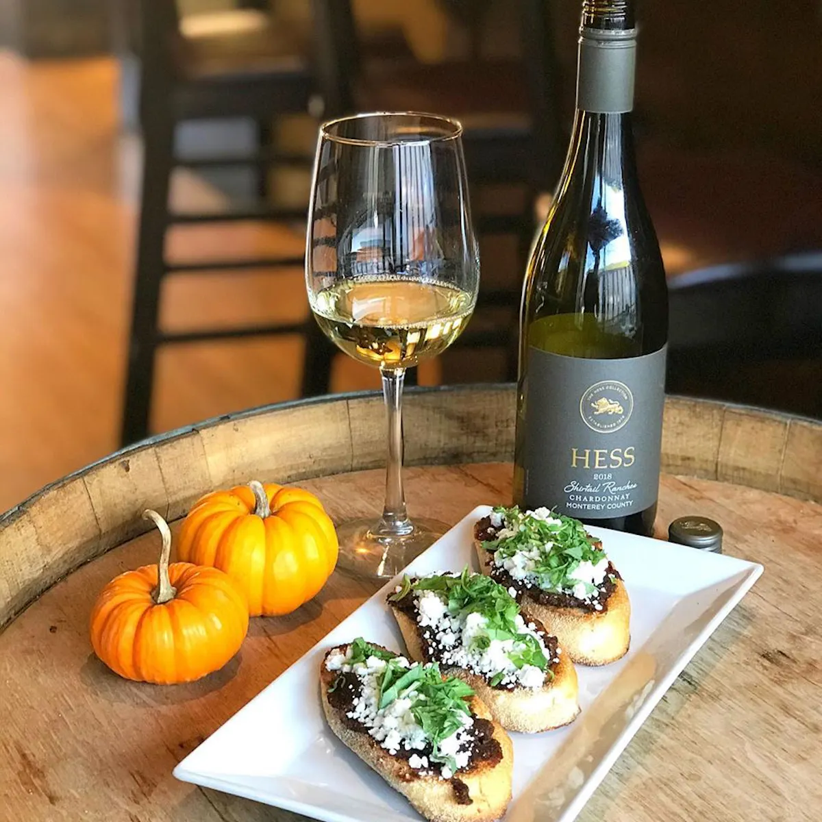 a plate of food and a glass of wine