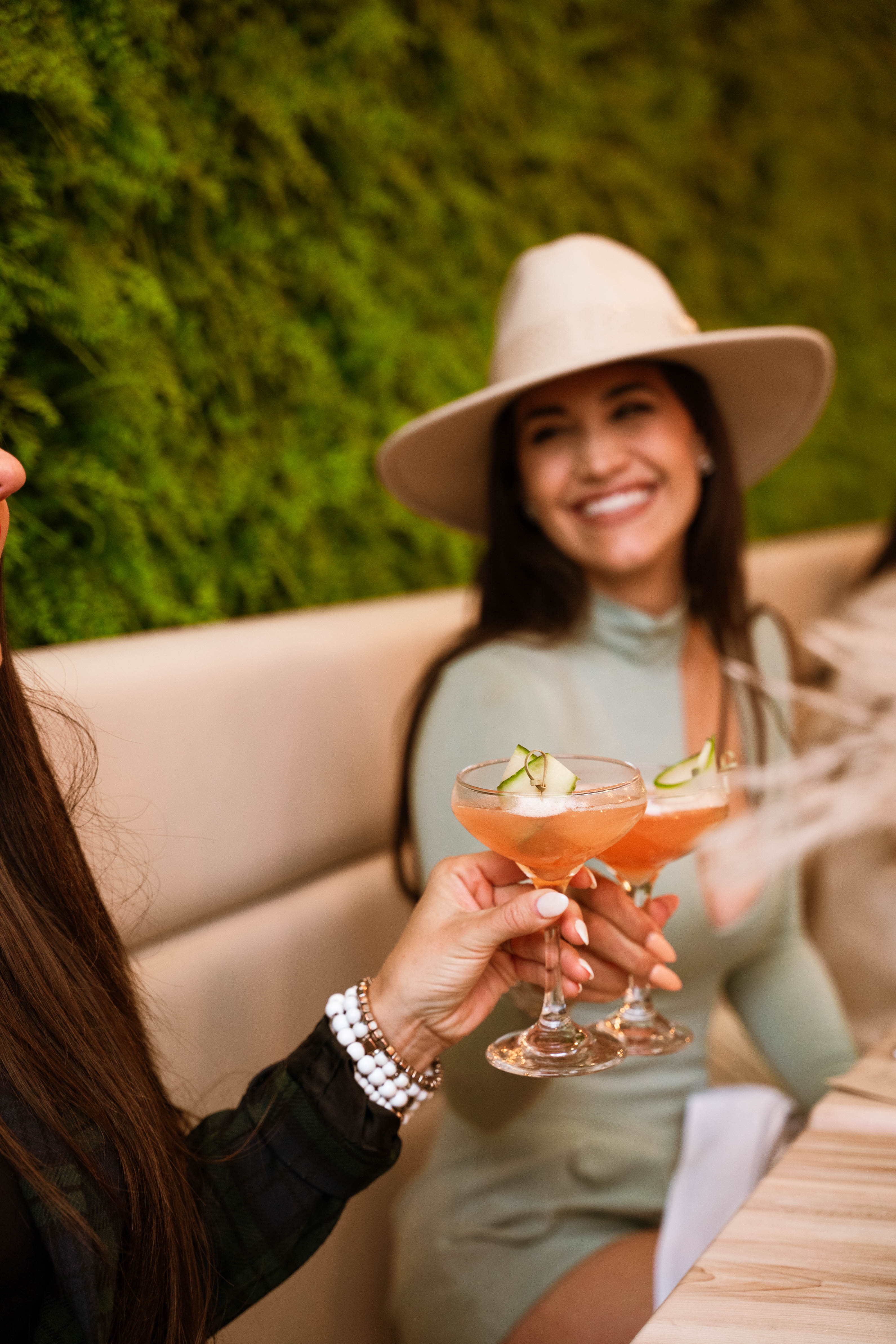 a woman holding a drink