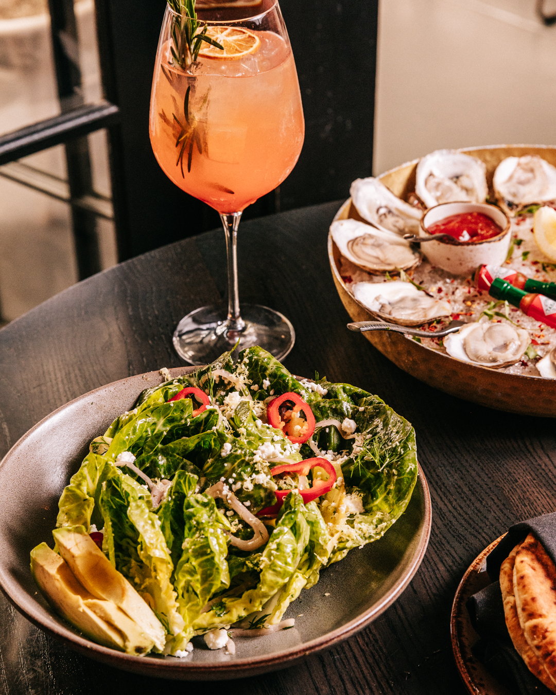 a plate of food and a drink on a table