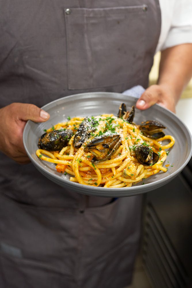 a man holding a plate of food