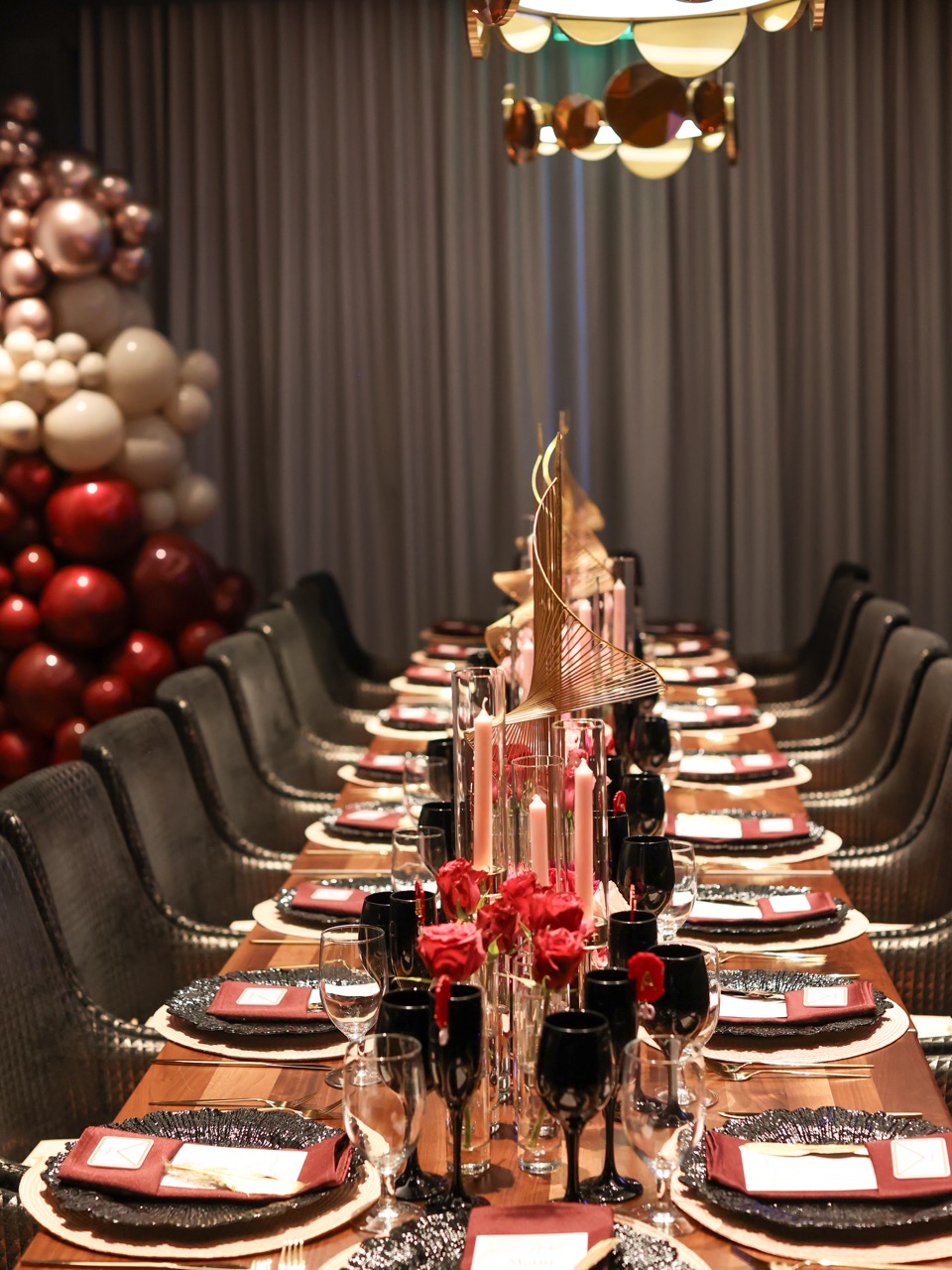 a row of wine glasses on a table