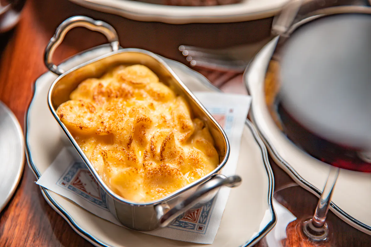 a plate of food and a spoon on a table