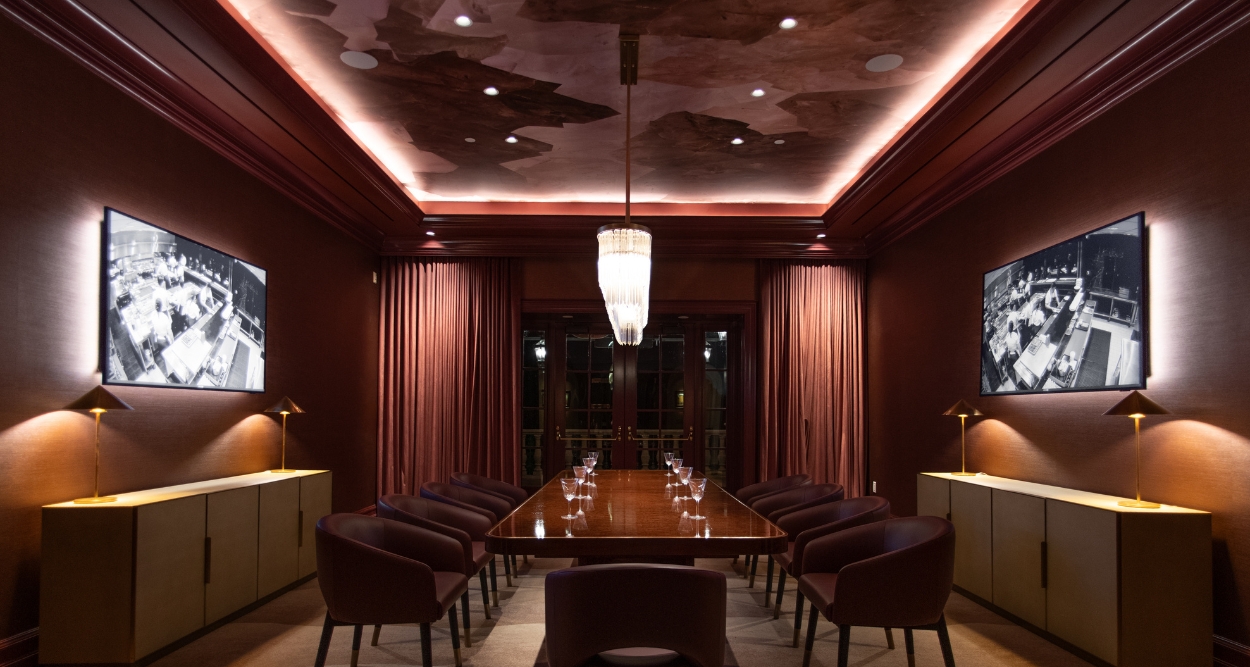 a room with a table and chairs