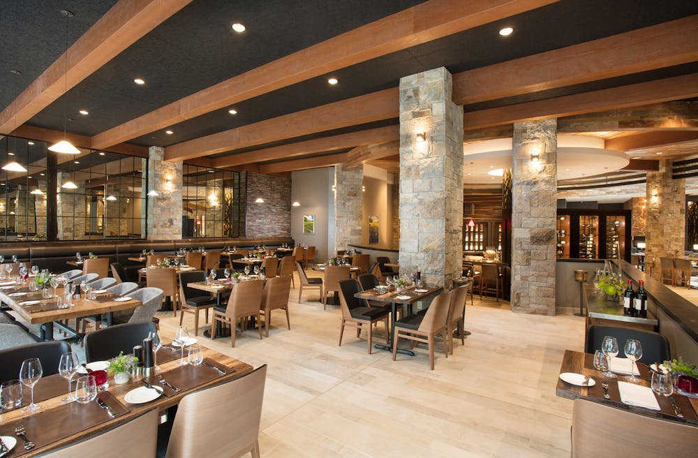 a room filled with furniture and a table in a restaurant