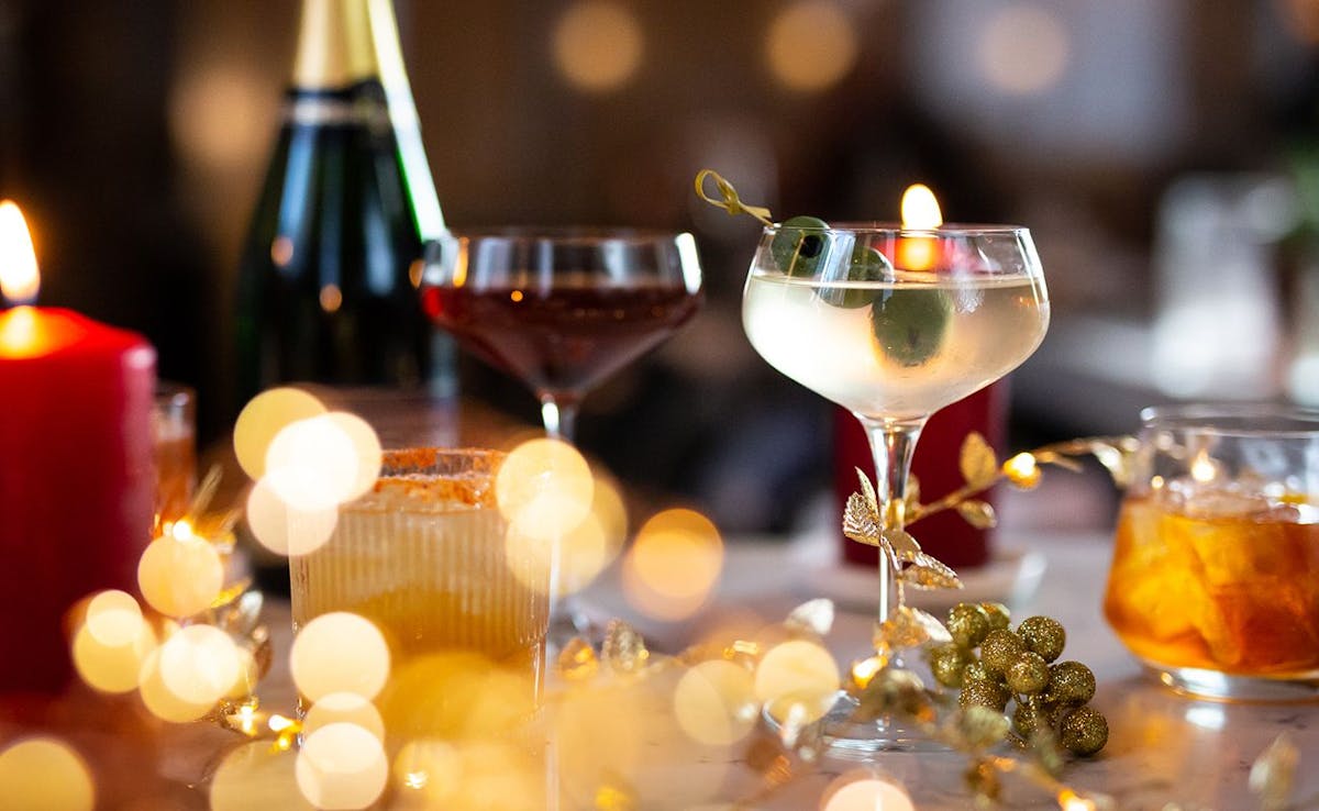 a group of people sitting at a table with wine glasses