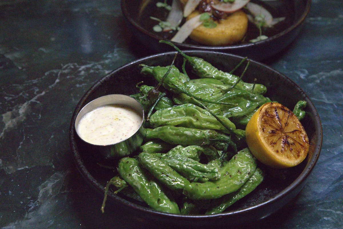 a bowl of food with broccoli