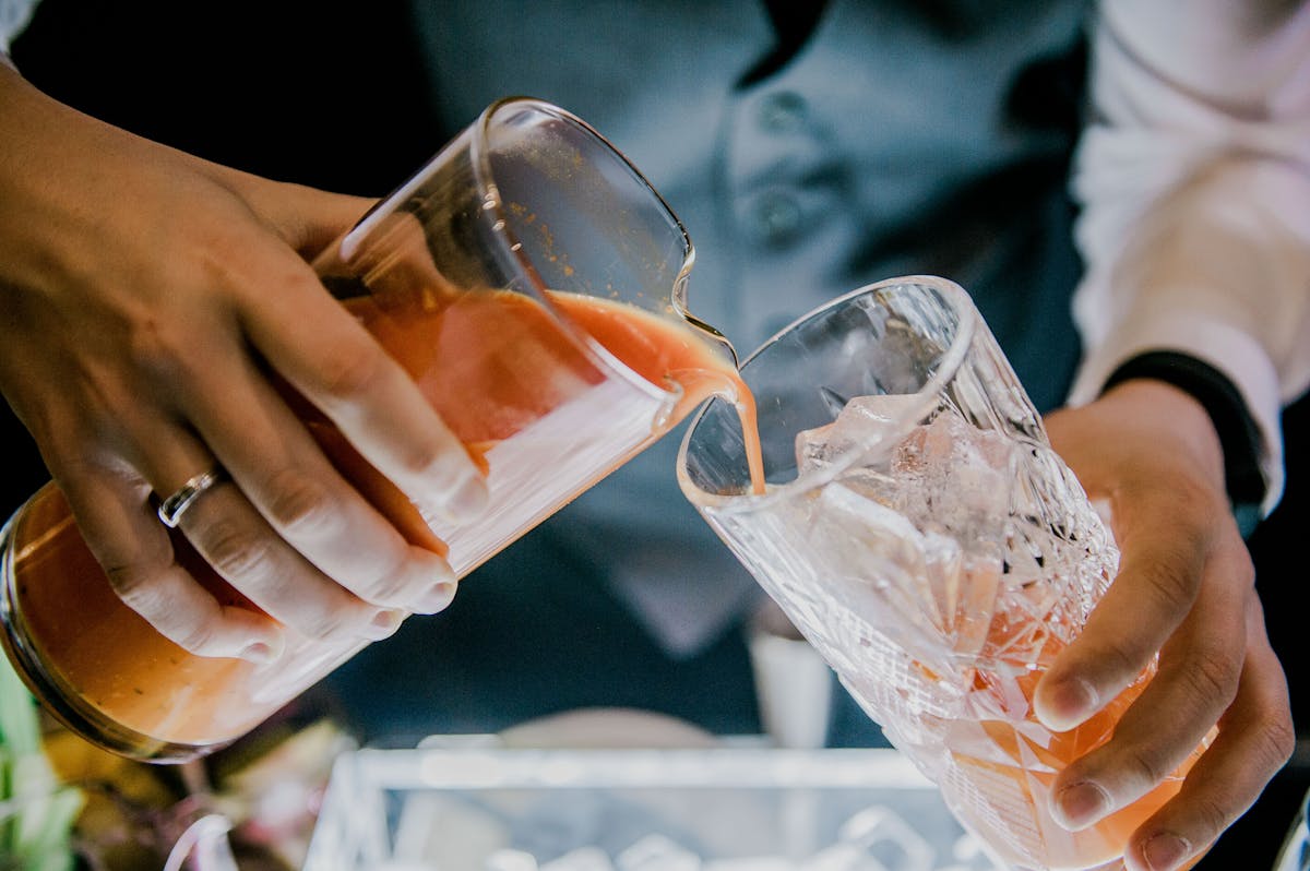 a close up of a person holding a cup