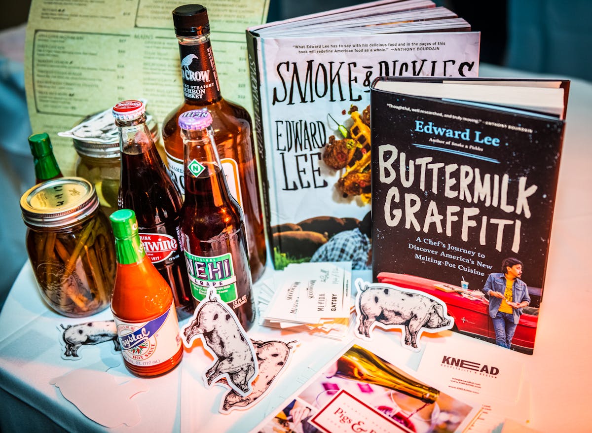a bottle of beer next to a book