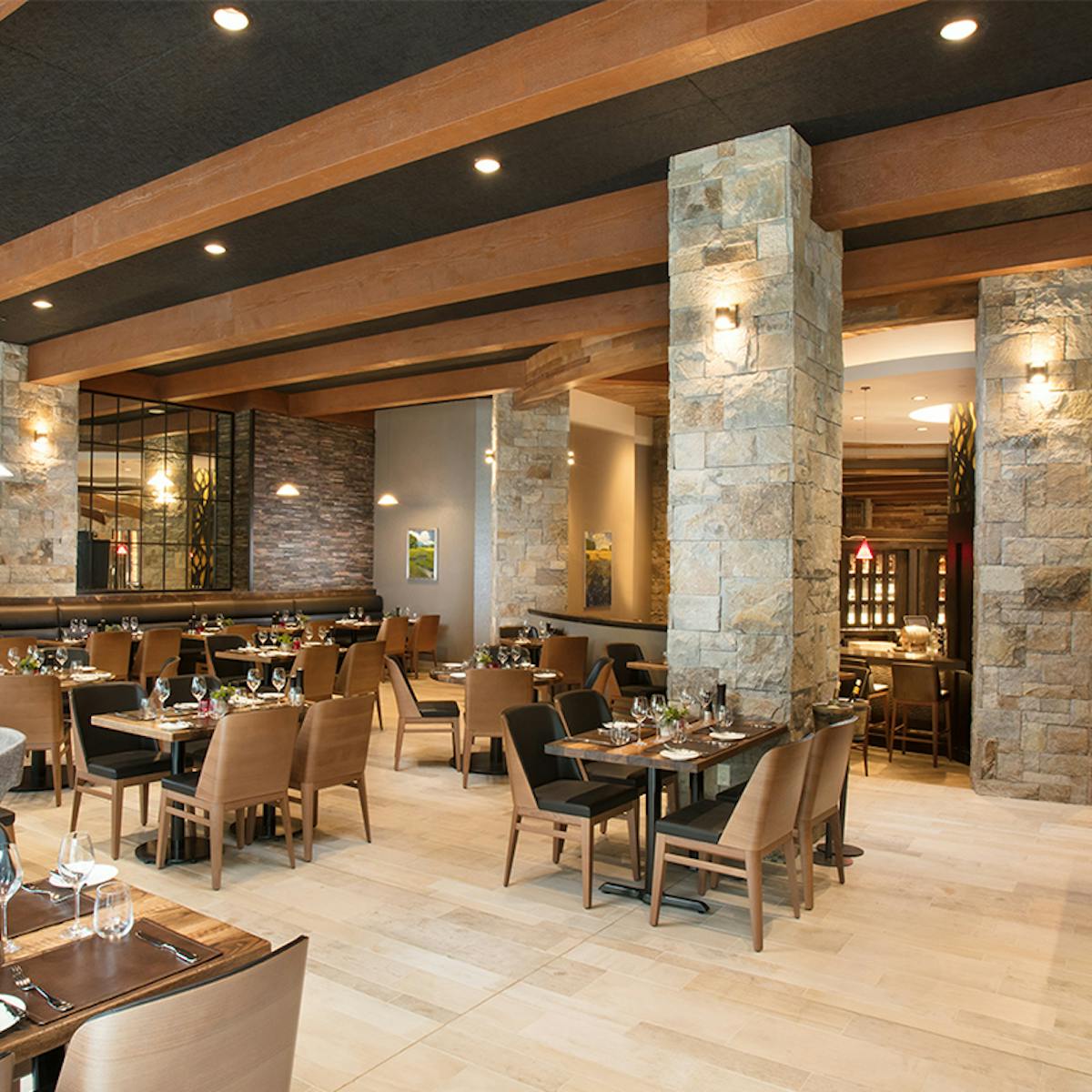 a room filled with furniture and a table in a restaurant