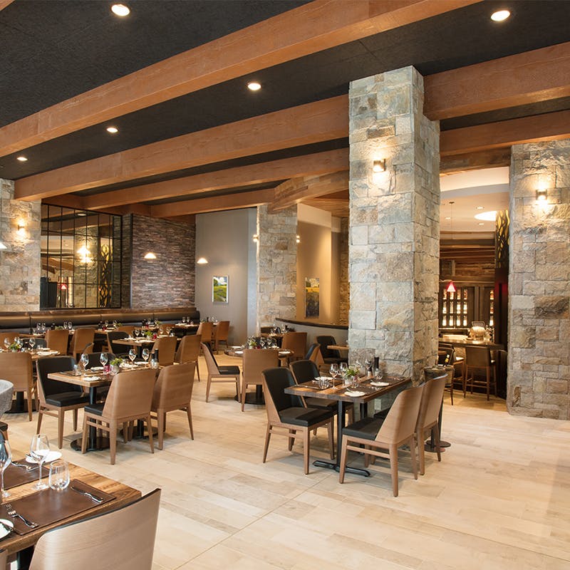 a room filled with furniture and a table in a restaurant