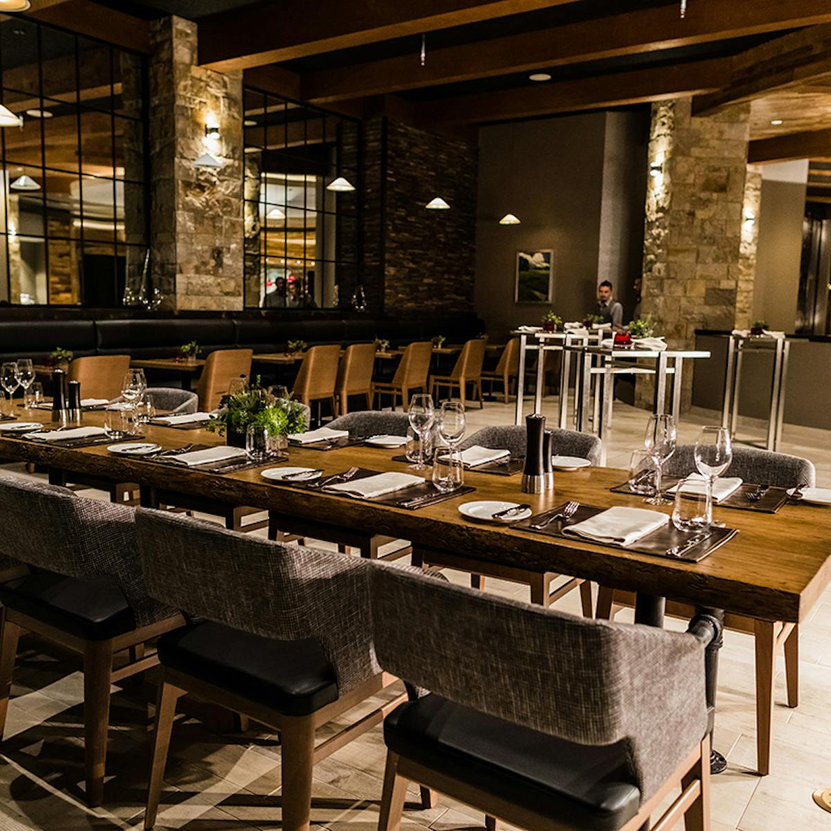 a kitchen with a table in a restaurant