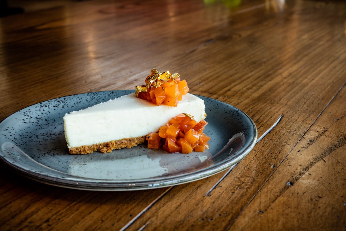 a plate of food sitting on top of a wooden floor
