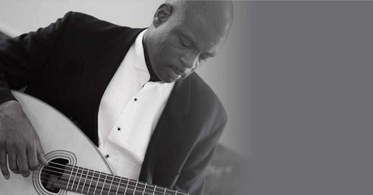 a man holding a guitar