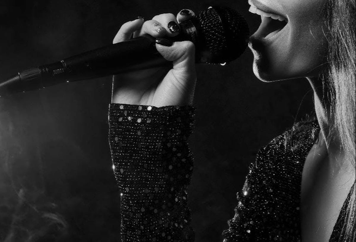 a woman holding a microphone