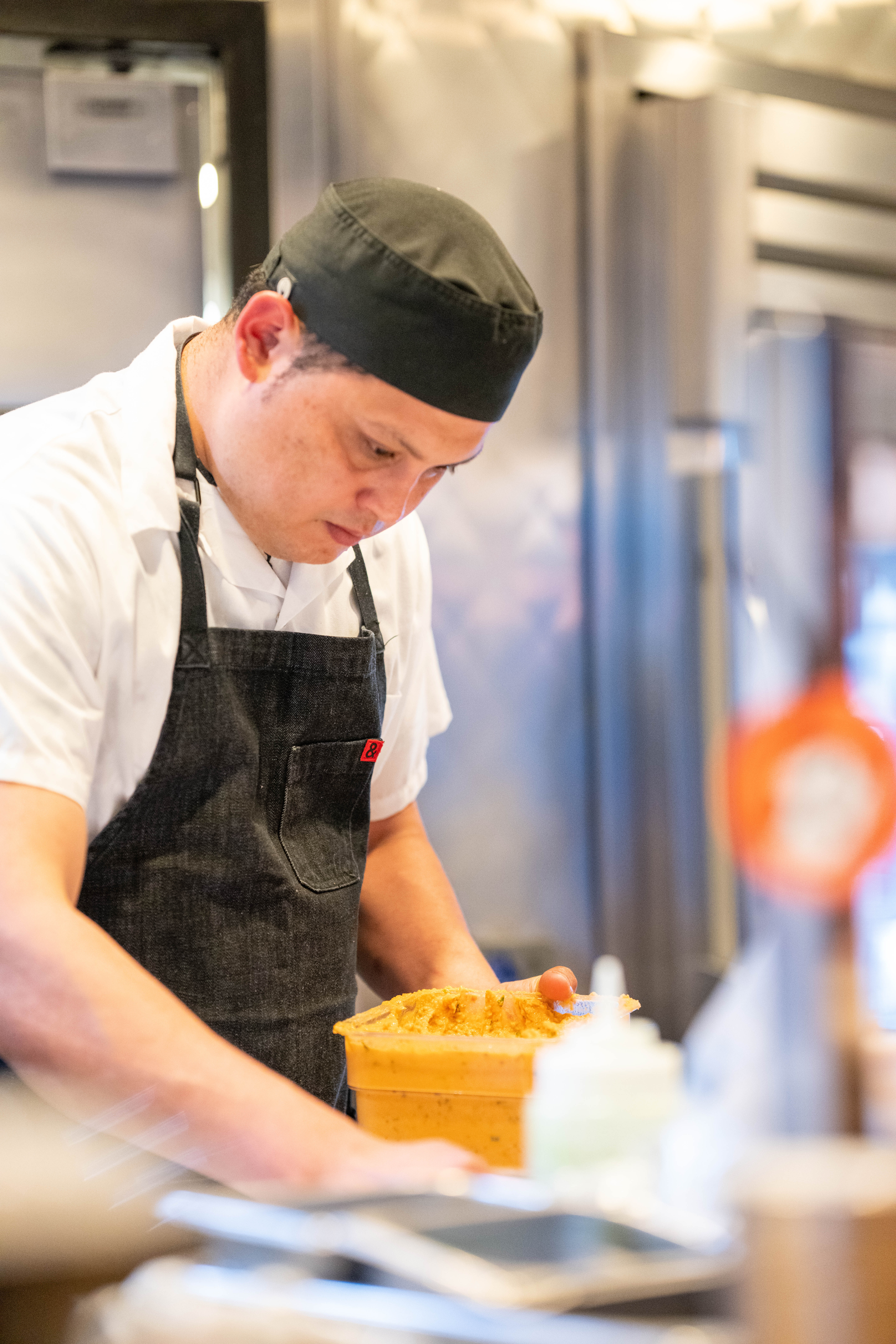 a person cutting a cake