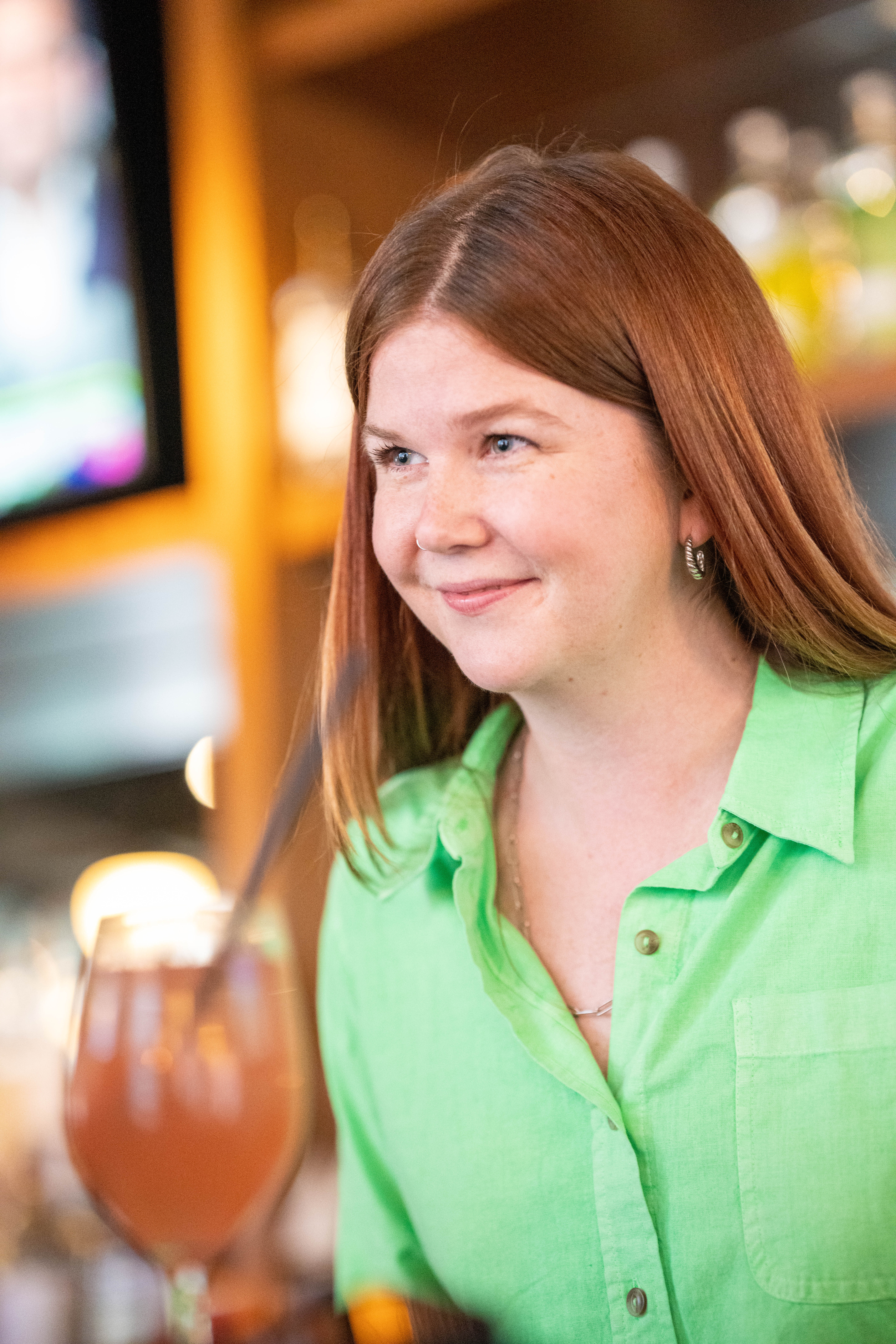 a woman wearing a green shirt