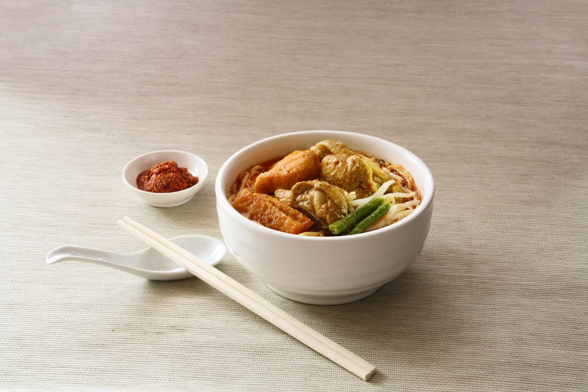 a bowl of food sitting on a table