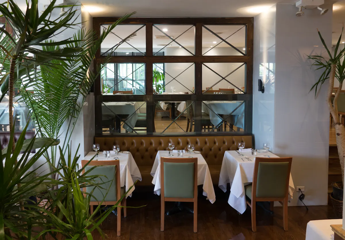 a dining room table in front of a window