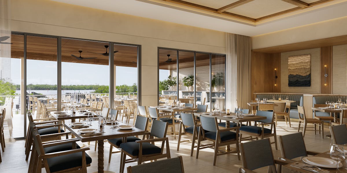 a dining room filled with furniture and a large window