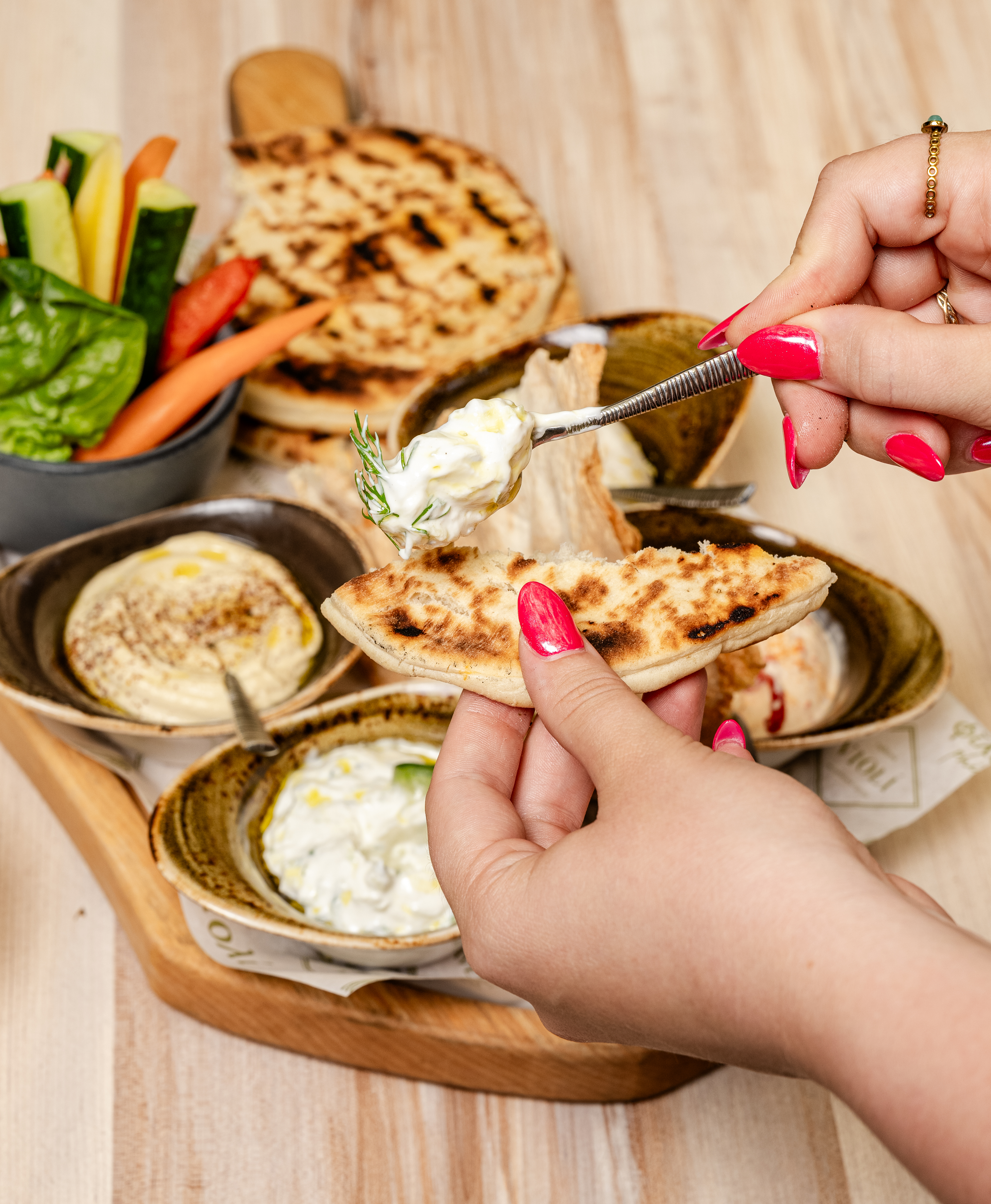 a person holding a plate of food