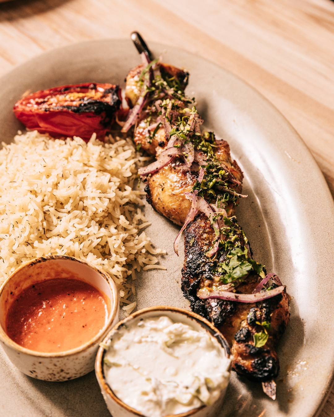 a plate of food with sauces and sauces