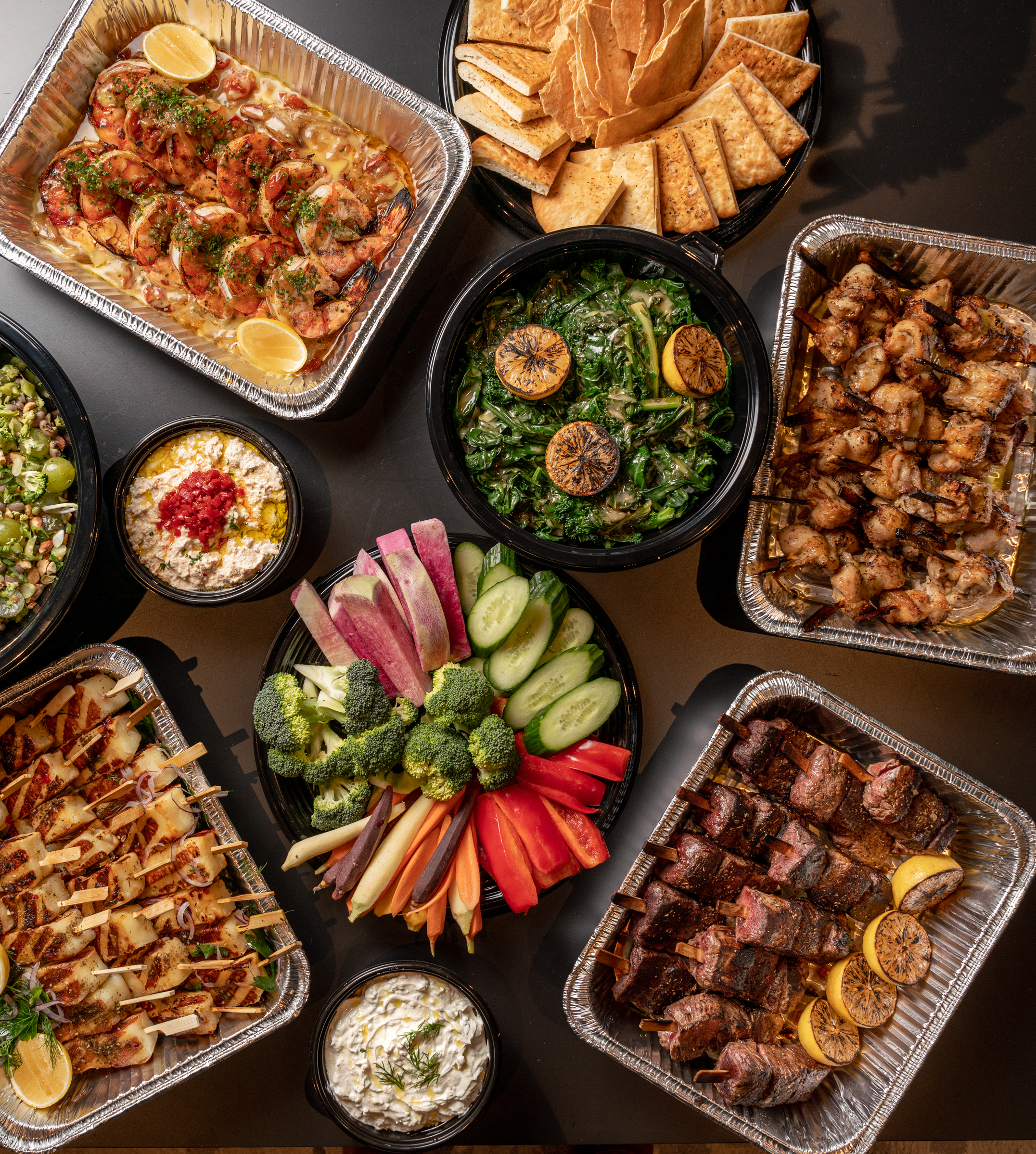 a bunch of food sitting on top of a wooden table