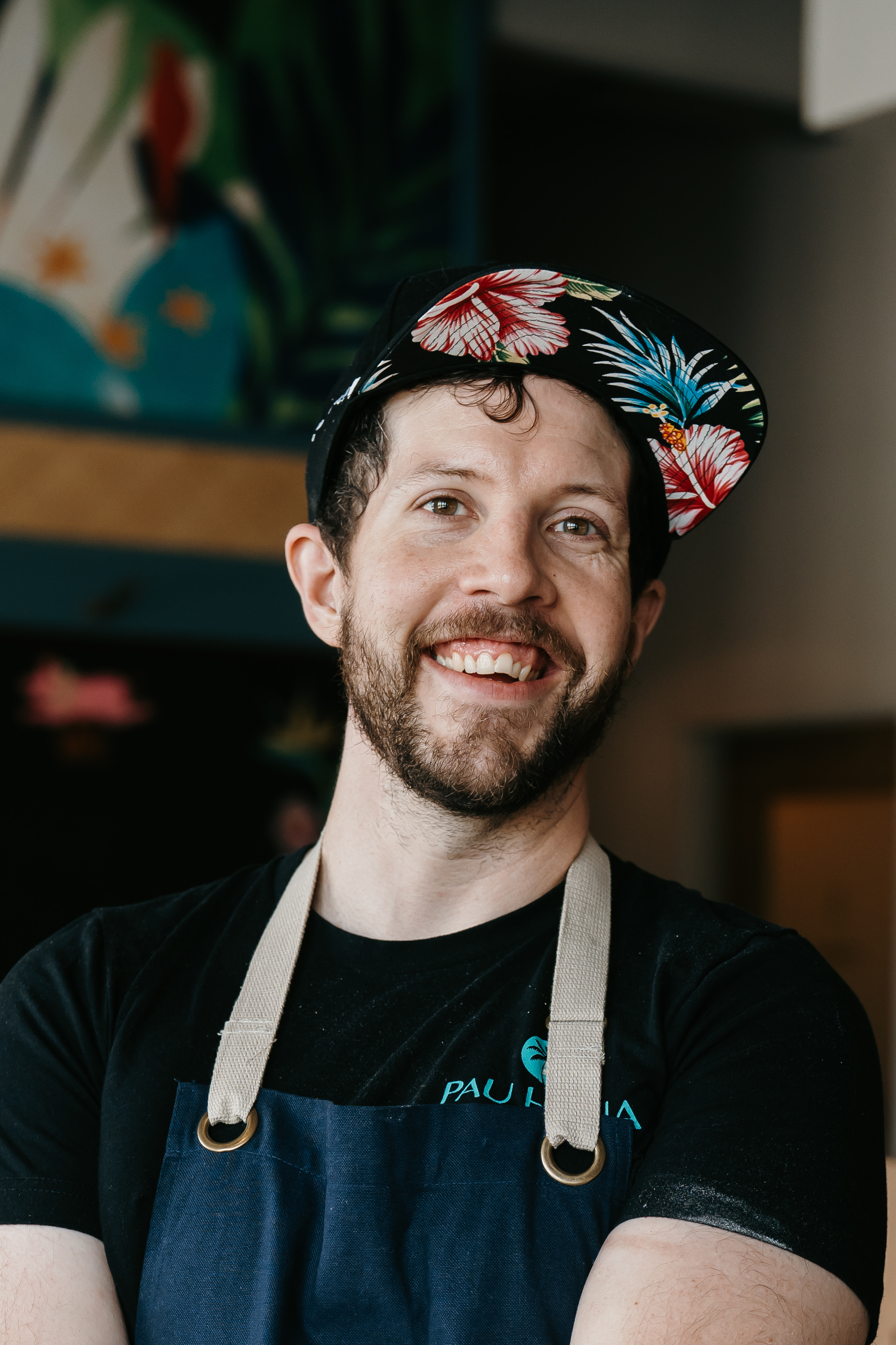 a man wearing a hat and apron