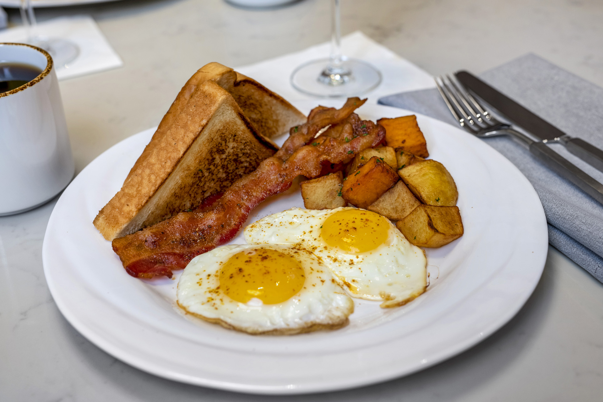 a plate of breakfast food is sitting on a table