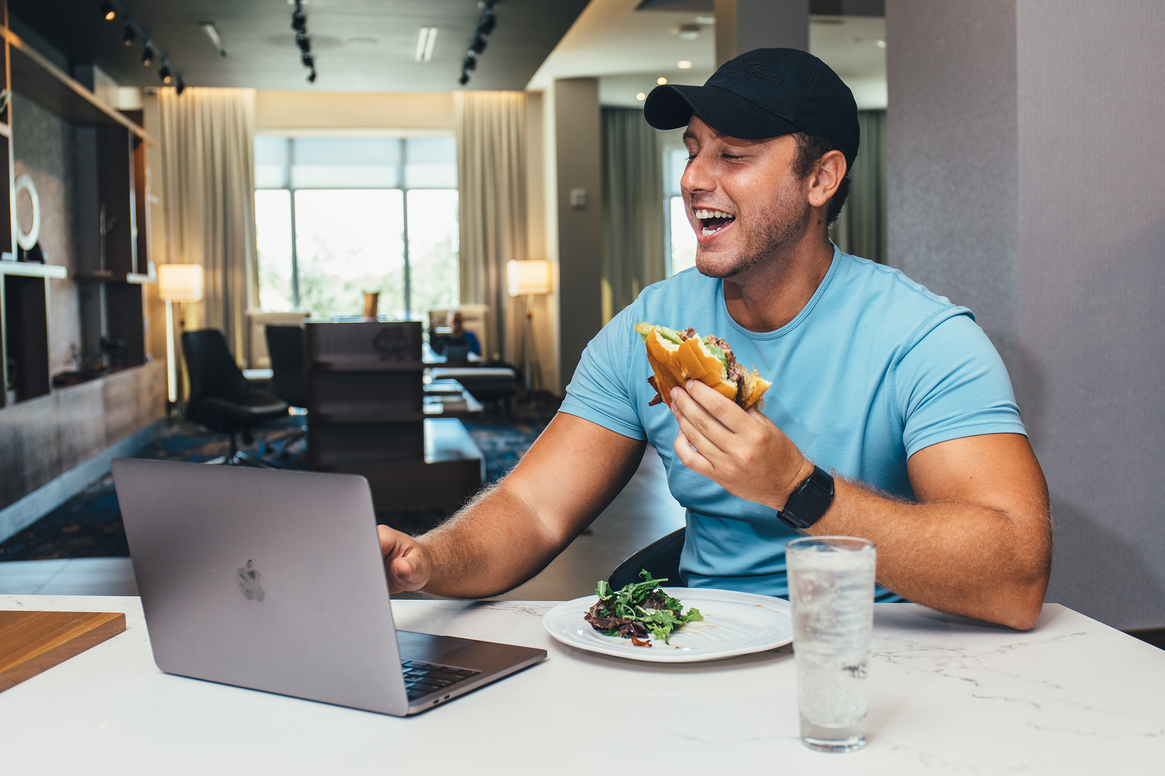 a man sitting at a table eating food