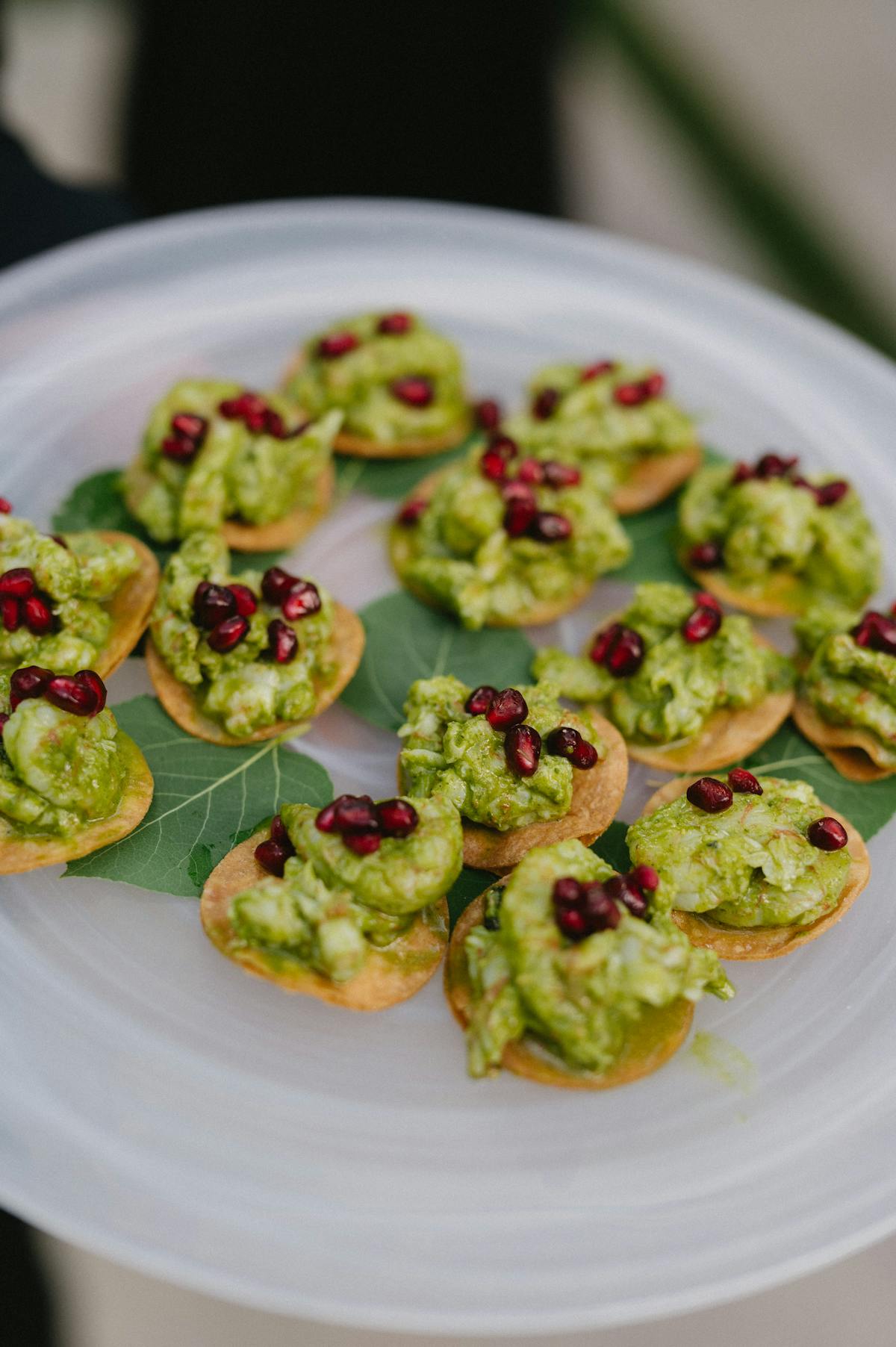 A tray of appetizers being passed at an event.