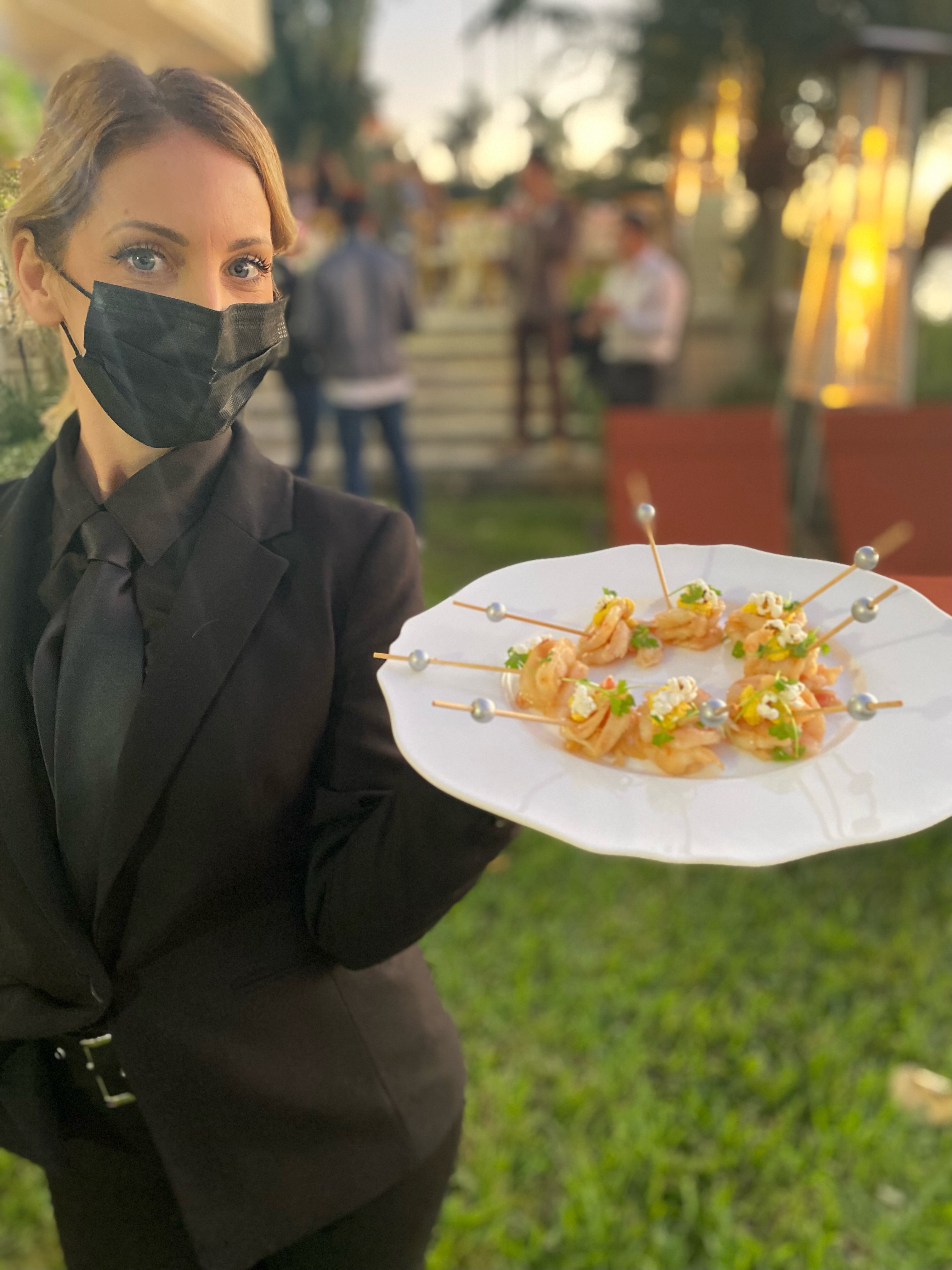 a person holding a plate of food