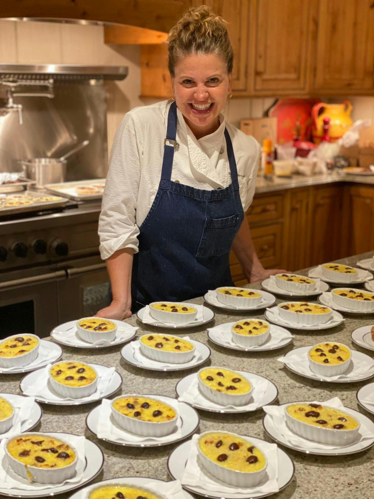 Michelle Bernstein preparing food in a kitchen