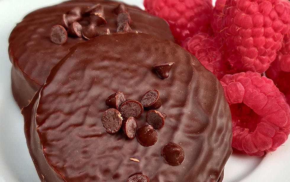 a close up of a piece of cake covered in chocolate