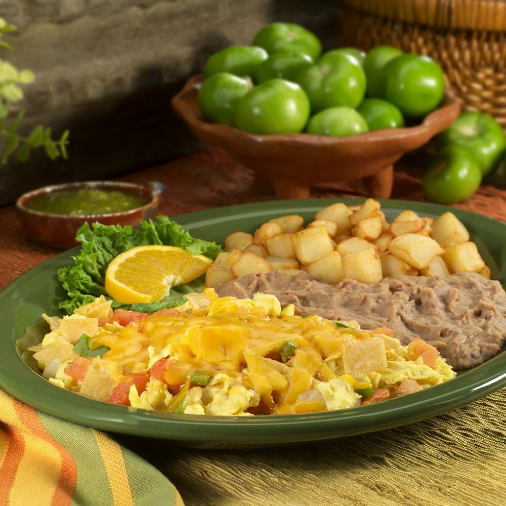 a bowl filled with different types of food, including meat and vegetables