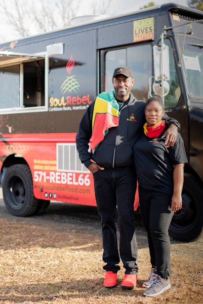 Tariq Trotter standing in front of a truck