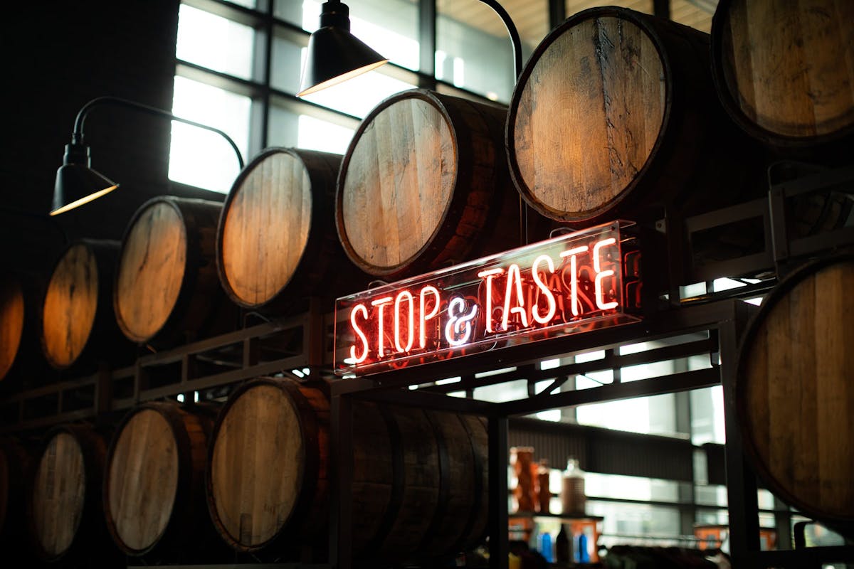 a sign in front of a barrel