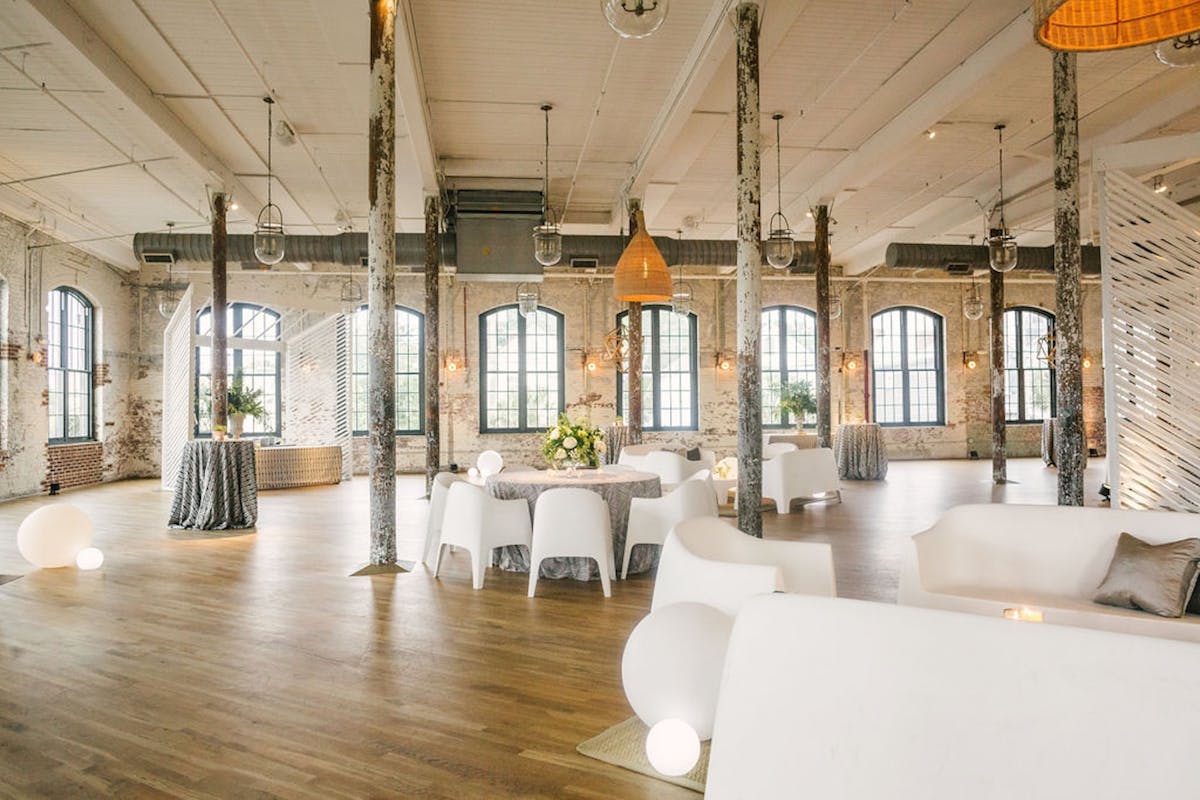 a living room filled with furniture and a large window