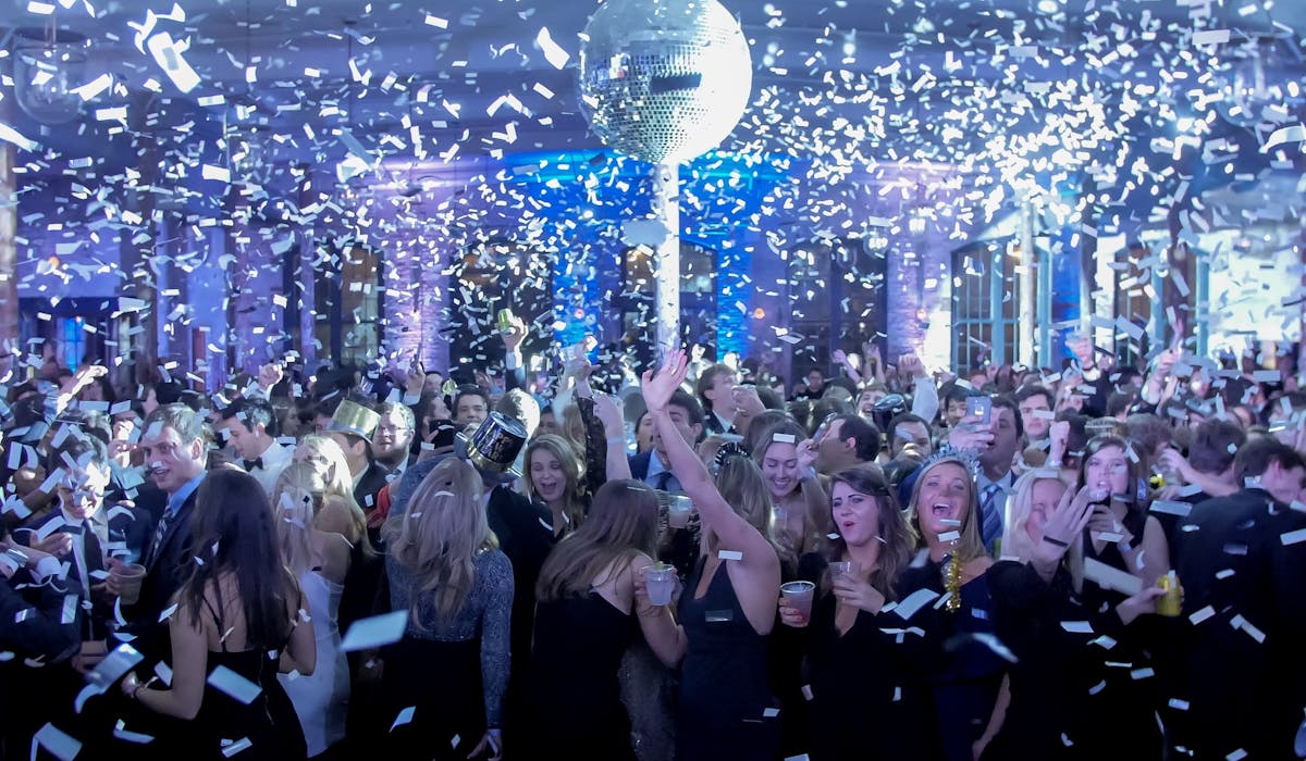 a group of people standing in front of a crowd