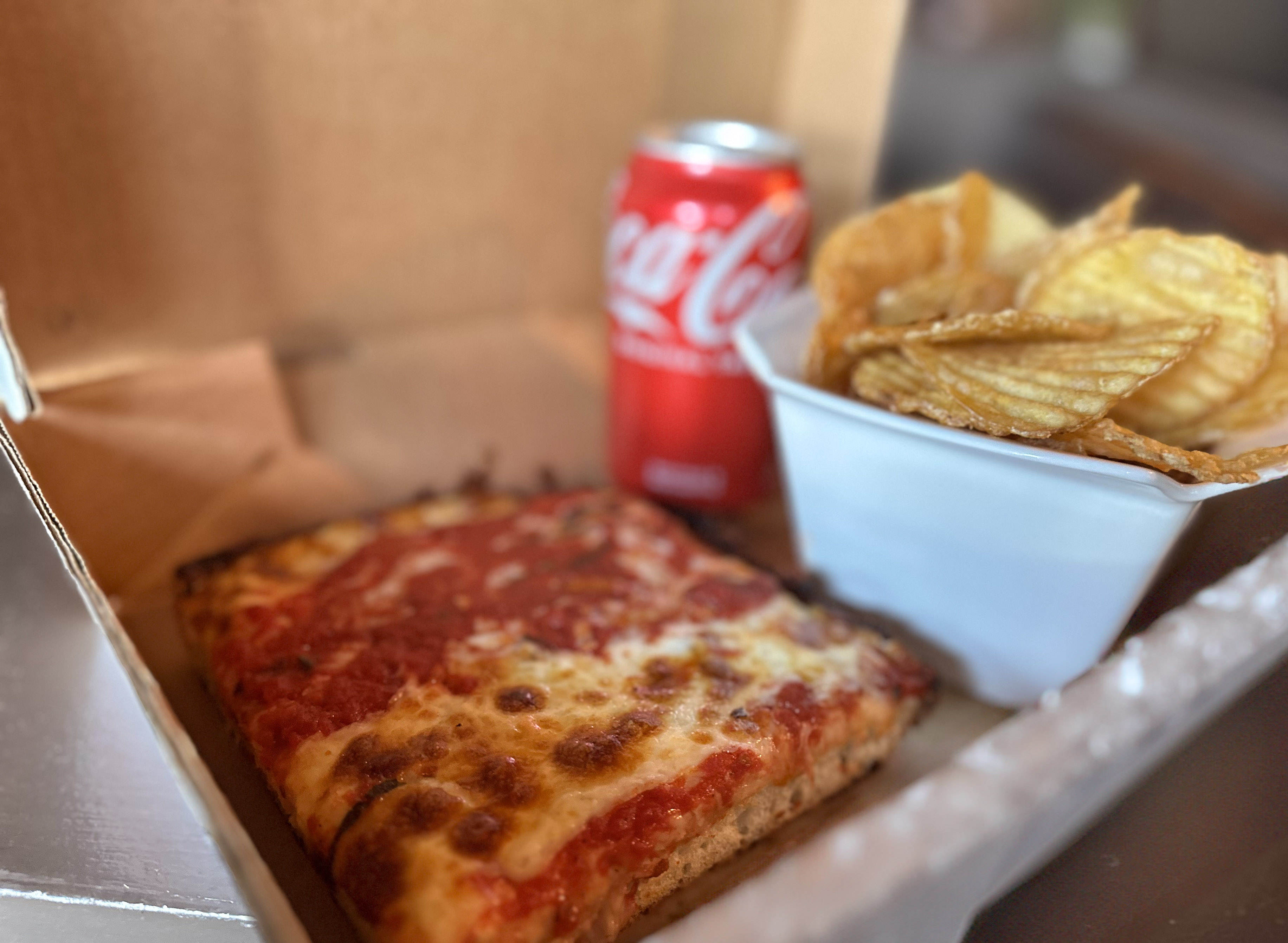 a slice of pizza on a tray