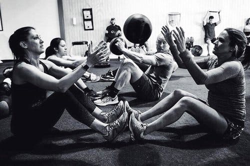 a group of people sitting around each other