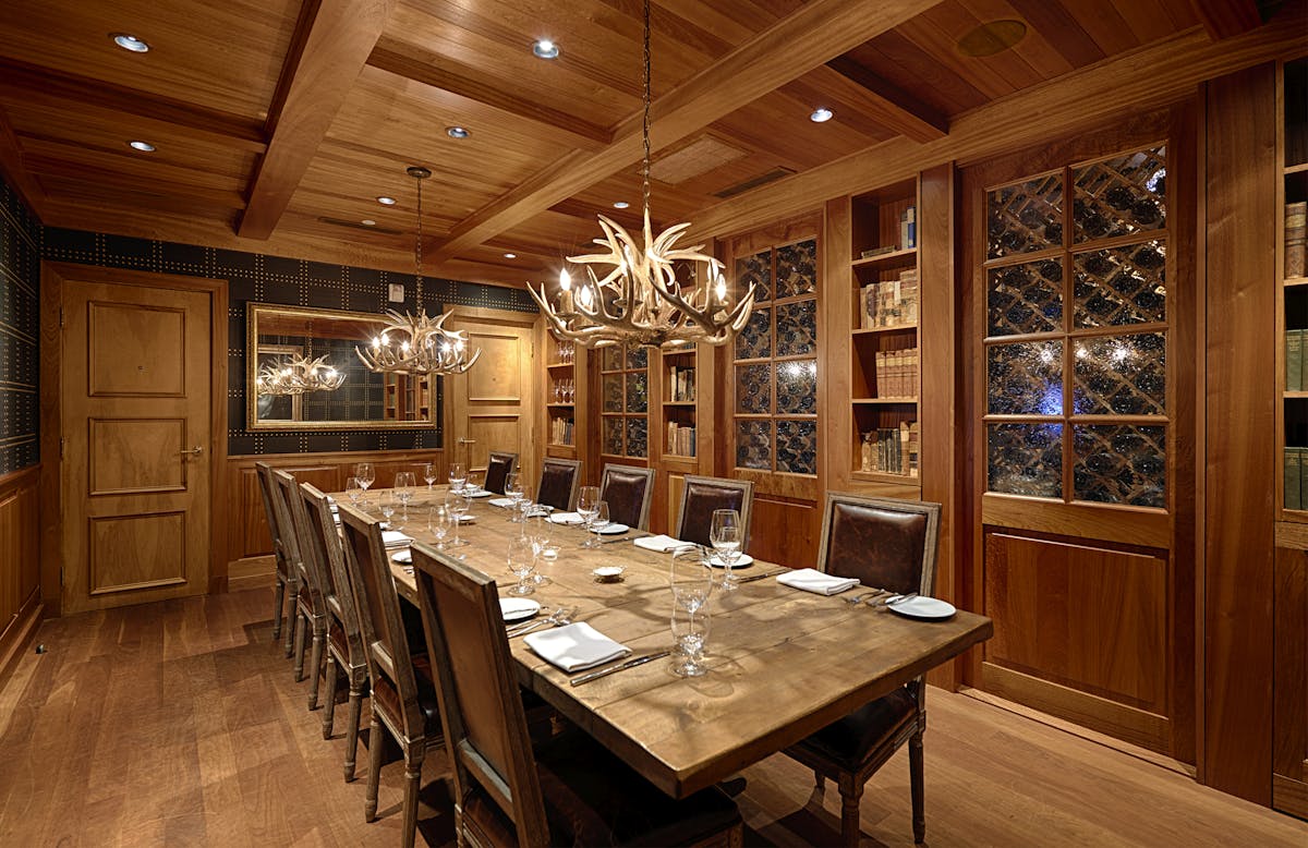 a large dining table topped with utensils