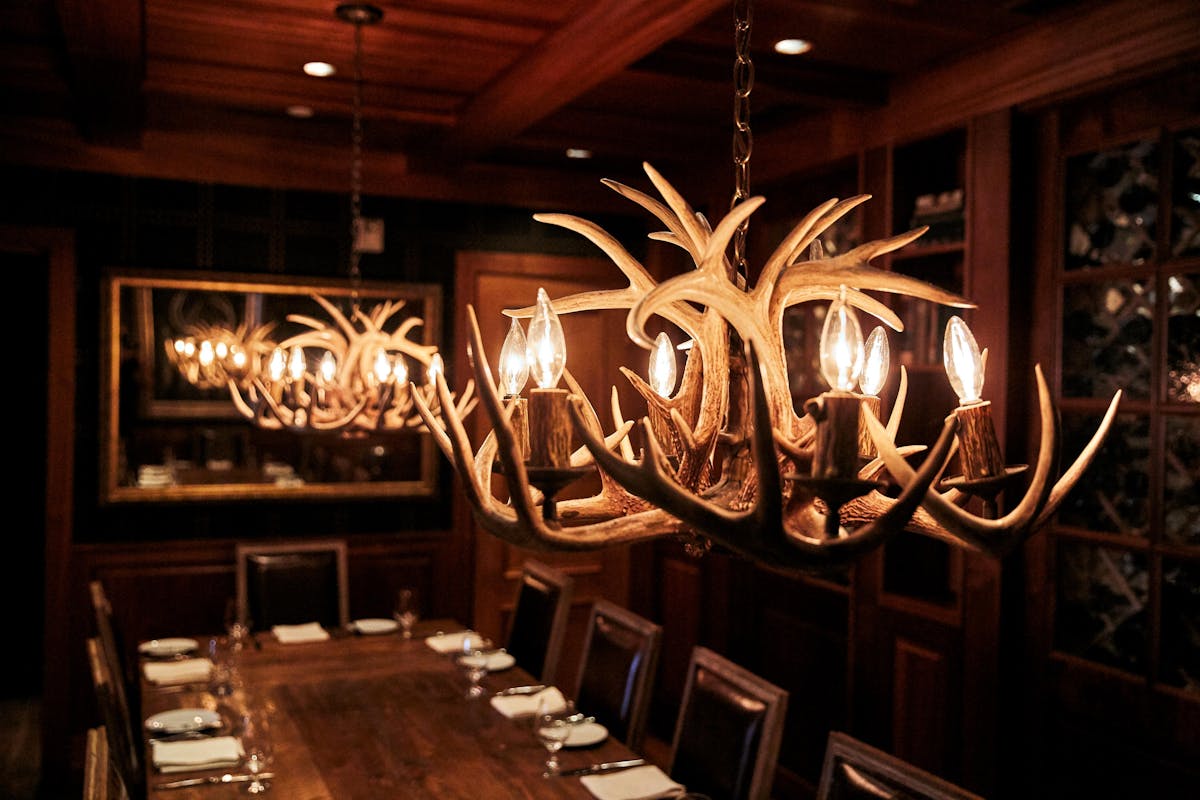 a large dining table topped with utensils