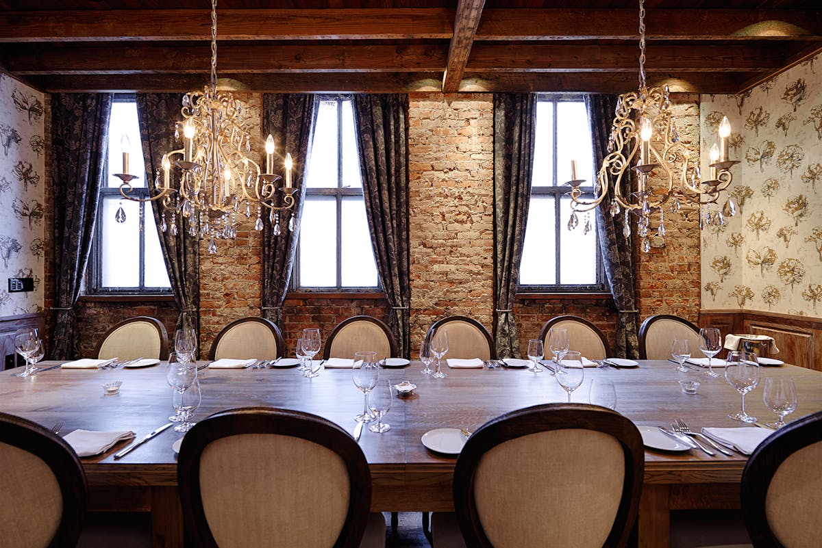 a large dining table topped with utensils