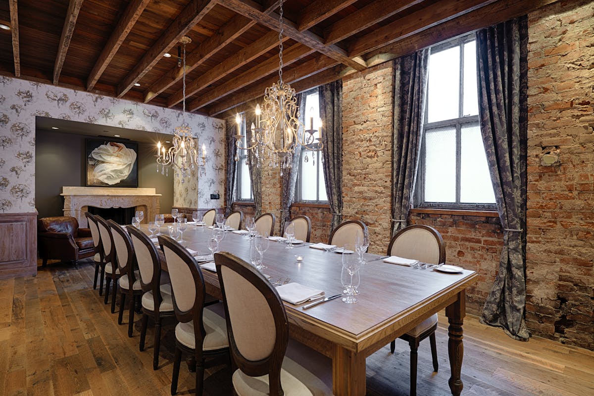 a large dining table topped with utensils