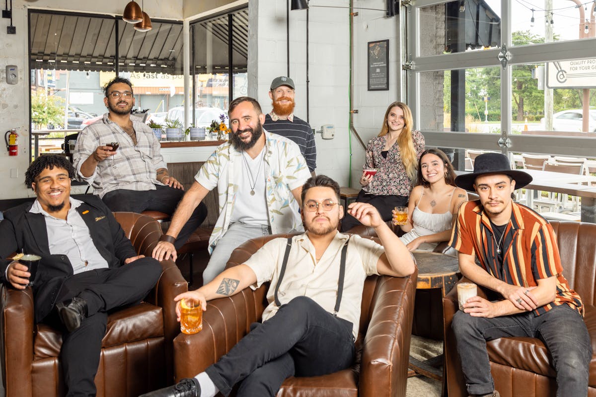 a group of people sitting posing for the camera