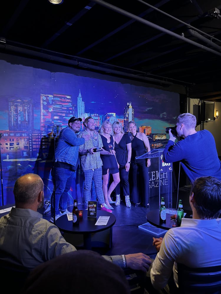 a group of people standing on a stage