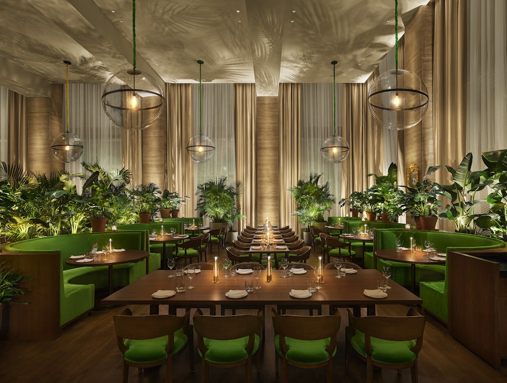 a room filled with furniture and a blue curtain